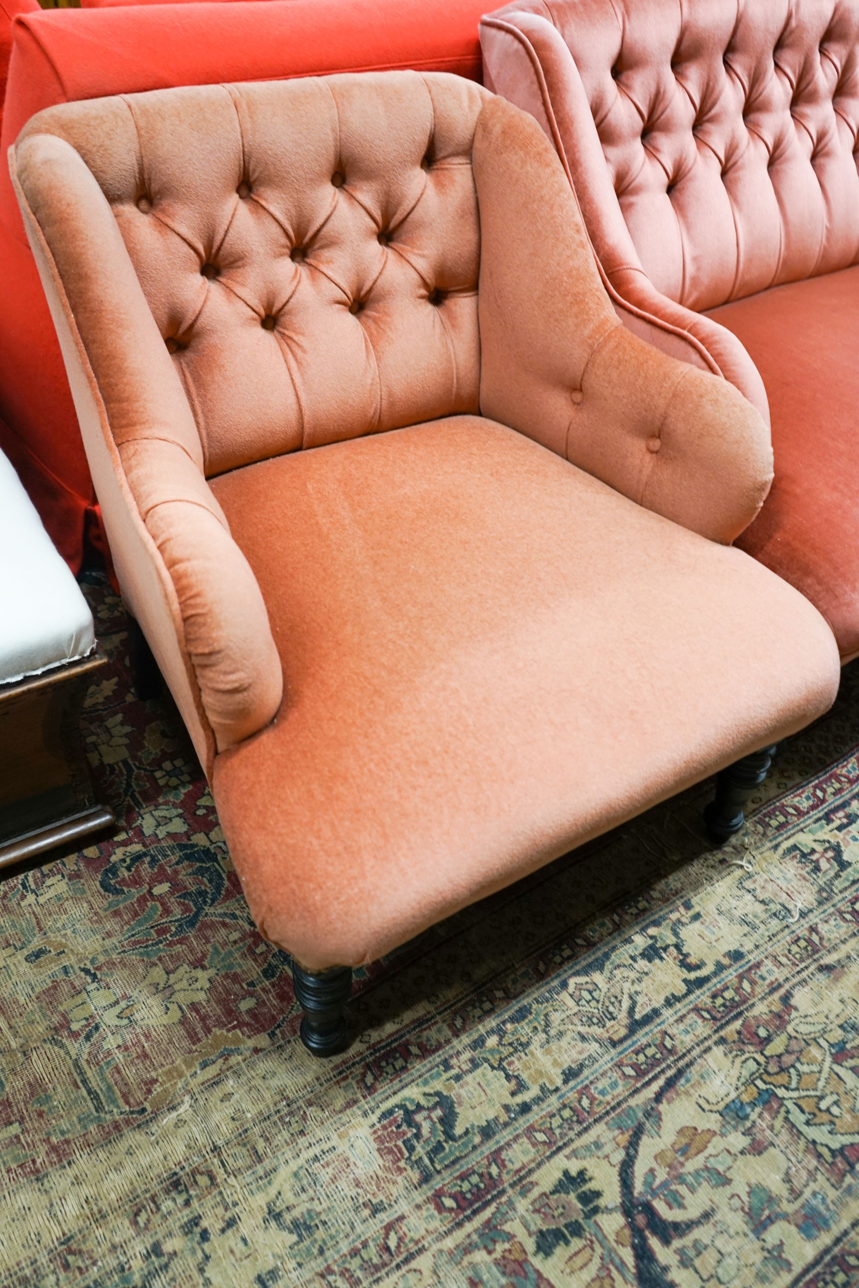 A late Victorian three piece lounge suite, upholstered in pink dralon, settee length 140cm, depth 80cm, height 78cm